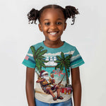 Afro Christmas in Liberia Kid T shirt Santa Chill on Tropical Beach - African Pride