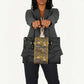 African Tribal Heritage Leather Bag Black Gold Pattern