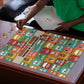 Everyday Genius Powered by Black Minds Puzzle with Colorful Invention Icons Pattern - African Pride