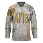 Apis Ancient Egyptian Hockey Jersey with Beige-Gray Hieroglyphic, Ornate Bull Head, and Gold-Blue Typography - African Pride